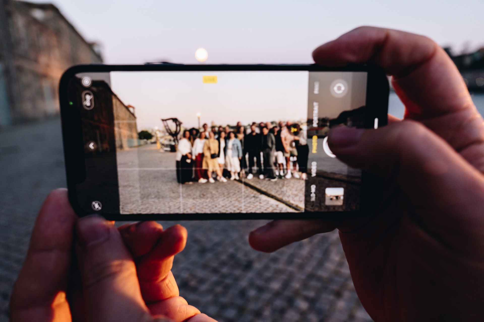 picture of a group photo been taking with a phone at Sketch meetup